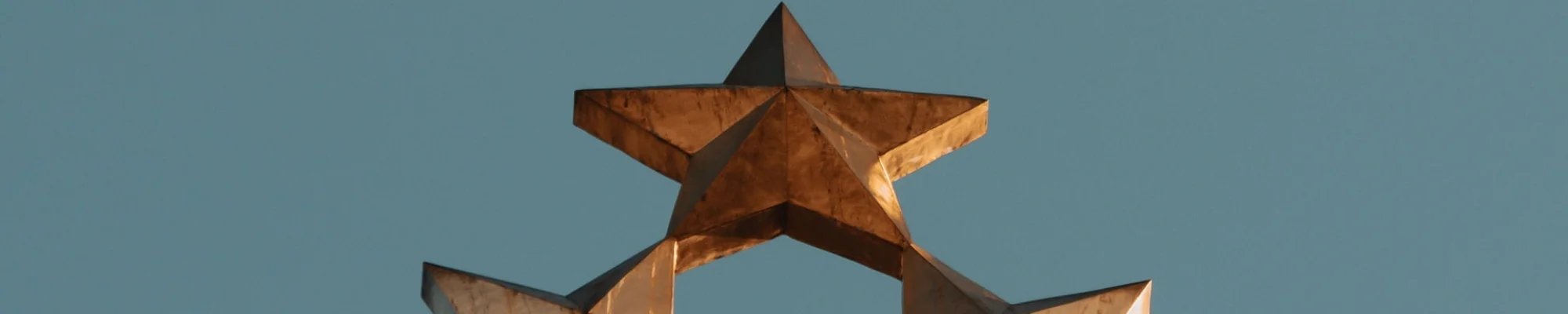Gold metal stars on a blue background